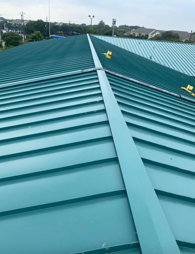 Green commercial metal roof ridge and valley for Metal Roof Repair in Lyndon